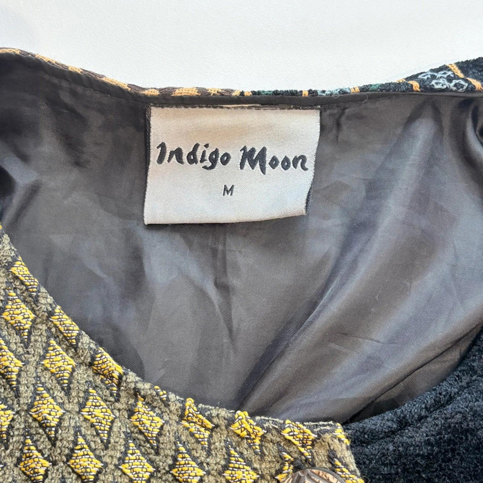 Indigo Moon label on a garment with embroidered details