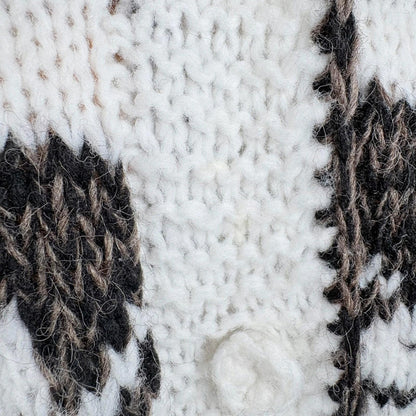 Close-up of a textured fabric with a pattern of black and white stripes.