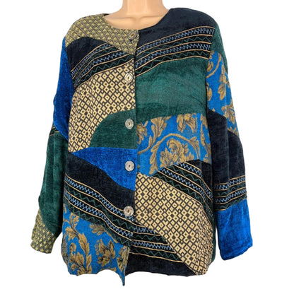 Mannequin wearing a patterned sweater with blue, green, and gold colors on a white background