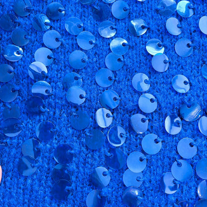 Close up of sequins on a blue jumper
