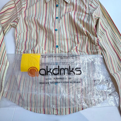 Striped shirt with a clear plastic bag displaying 'akdmks' branding on a white background