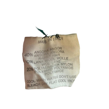 Textile product with material composition details on a white background