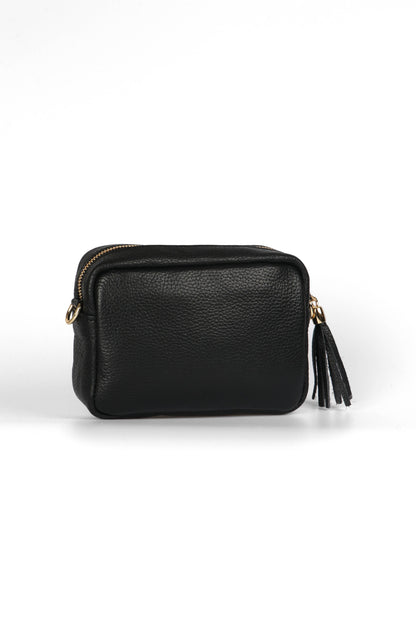 Black leather pouch with gold zipper and tassel on a white background