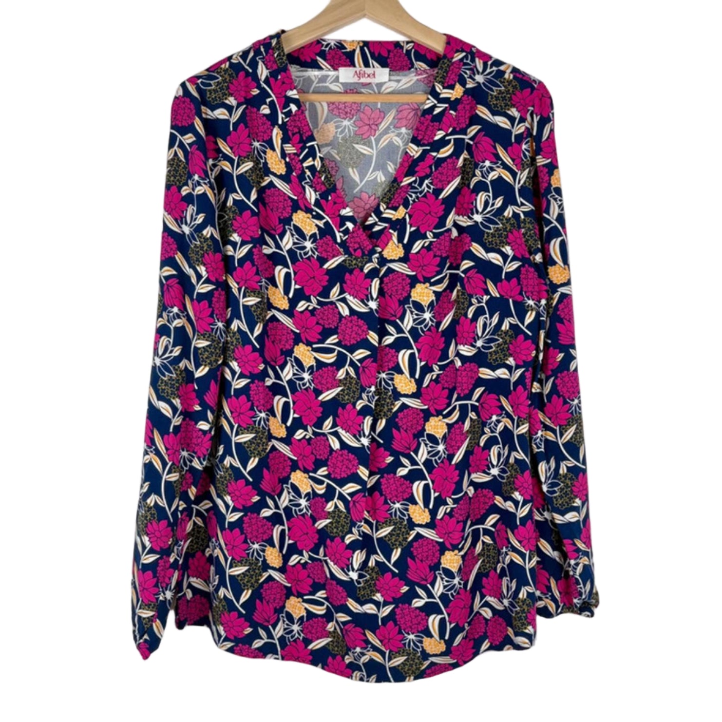 Floral patterned blouse on a hanger against a white background