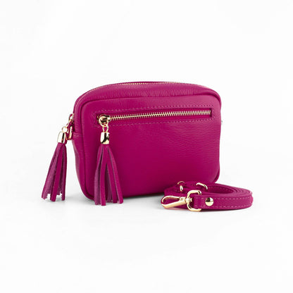 Purple handbag with gold accents on a white background