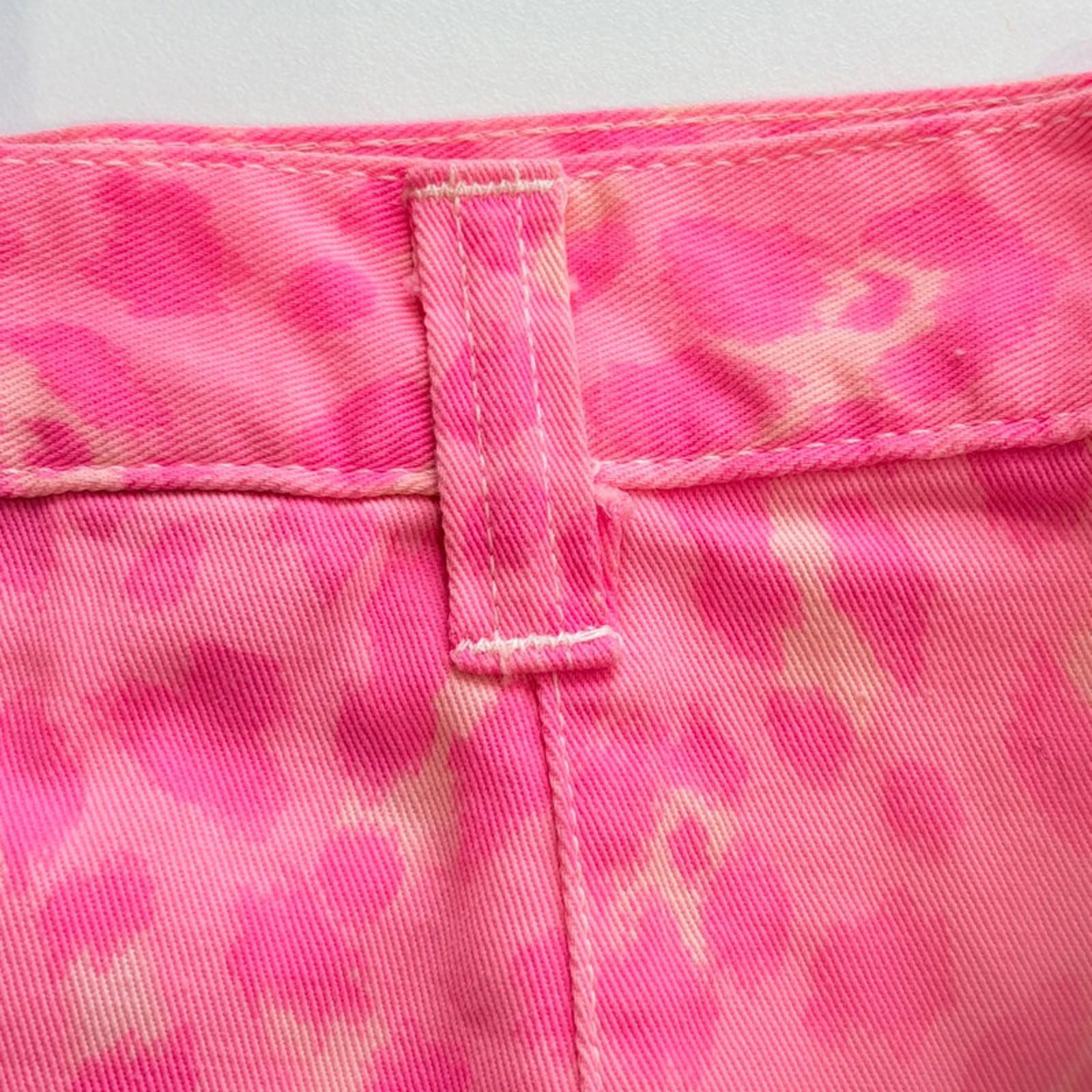 Close-up of pink camouflage fabric with a white background