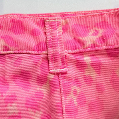 Close-up of pink camouflage fabric with a white background