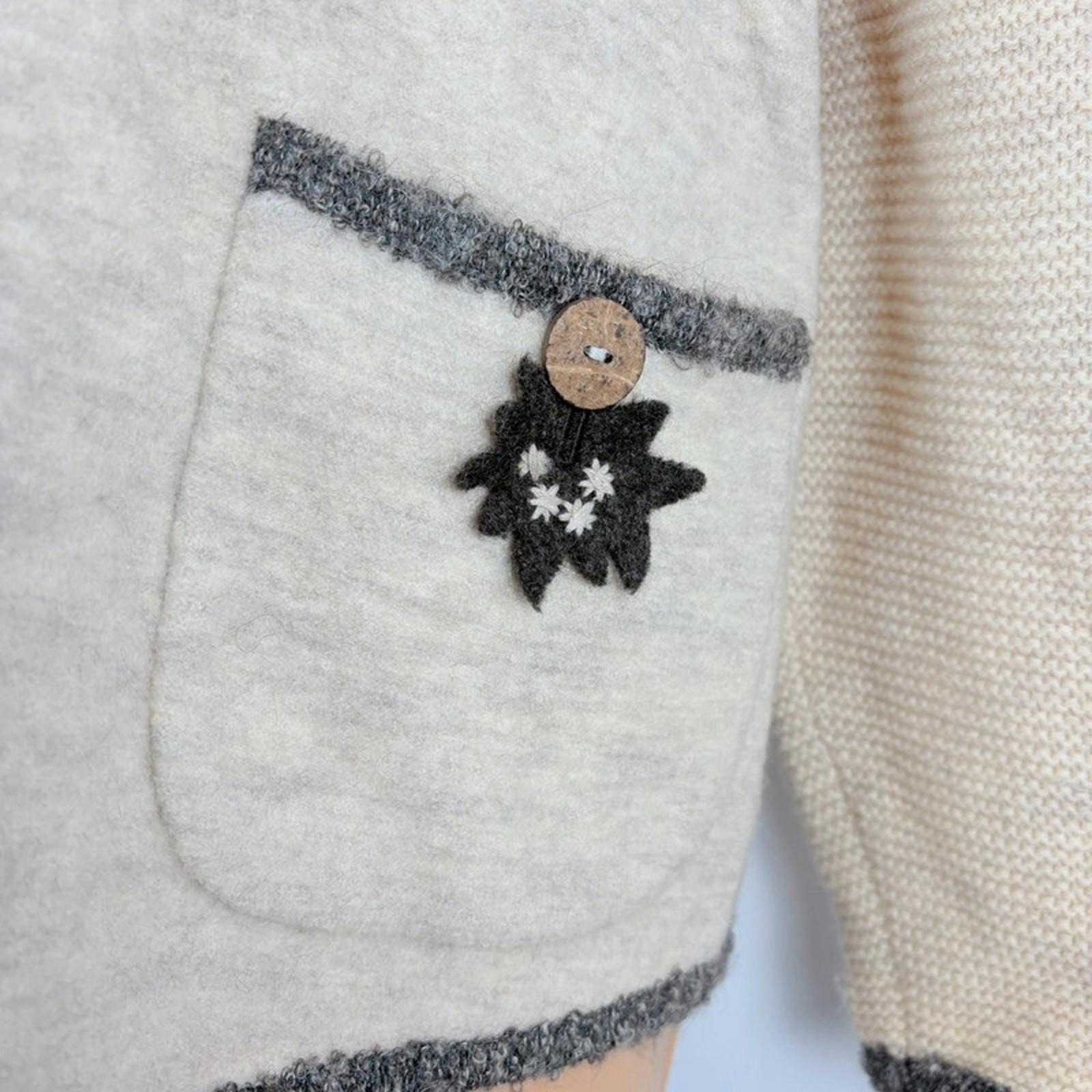 Close-up of a textured fabric with a button and floral design