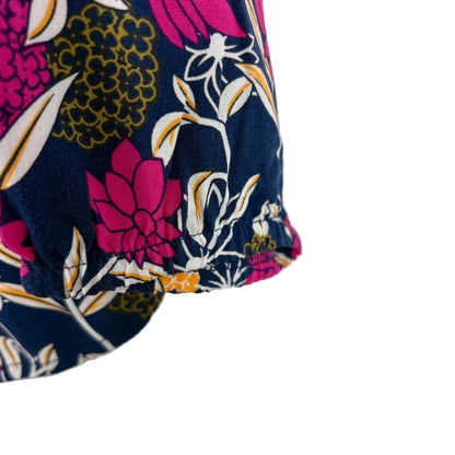 Floral-patterned fabric with pink, yellow, and blue colors on a white background