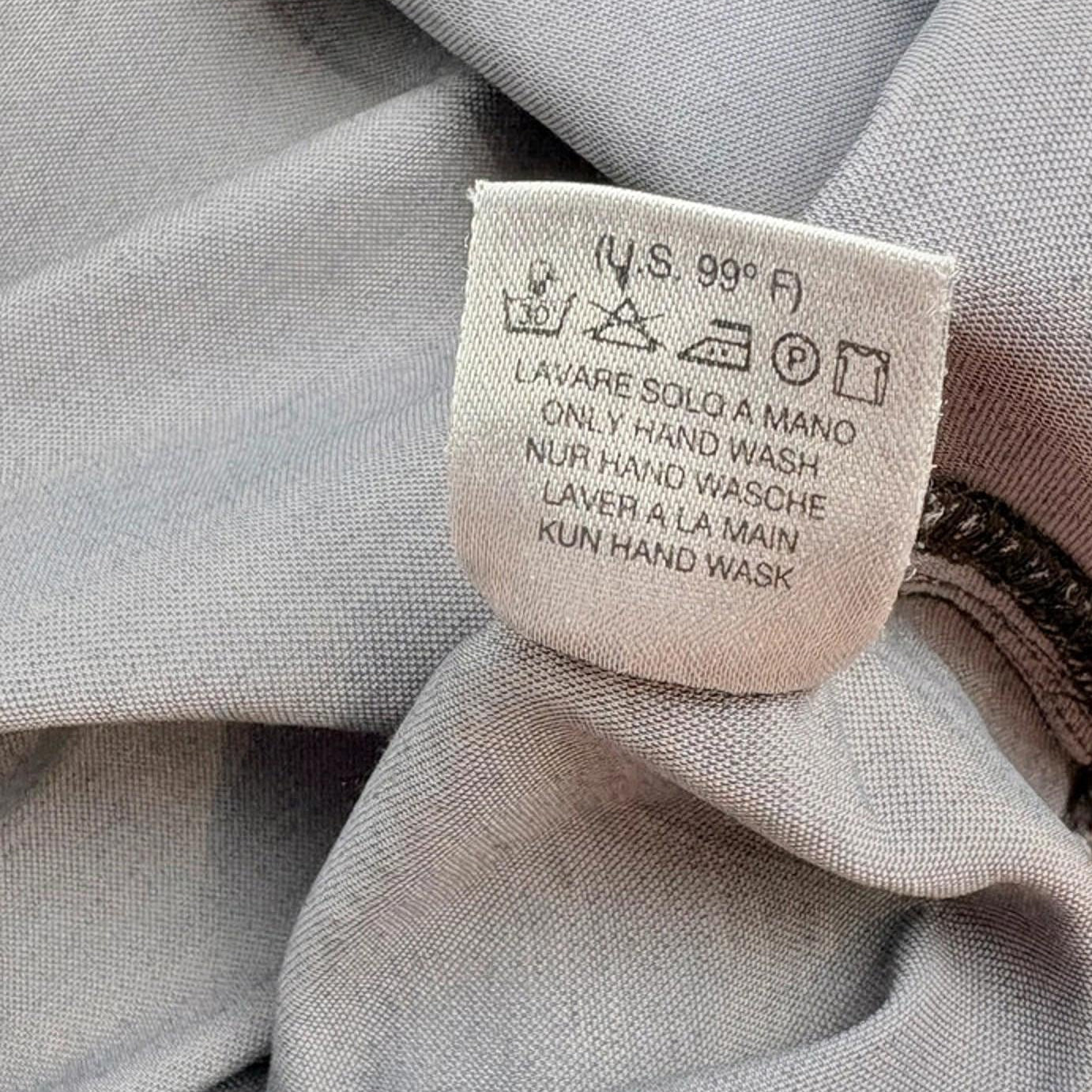Clothing label on a gray fabric background