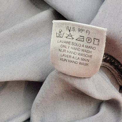 Clothing label on a gray fabric background