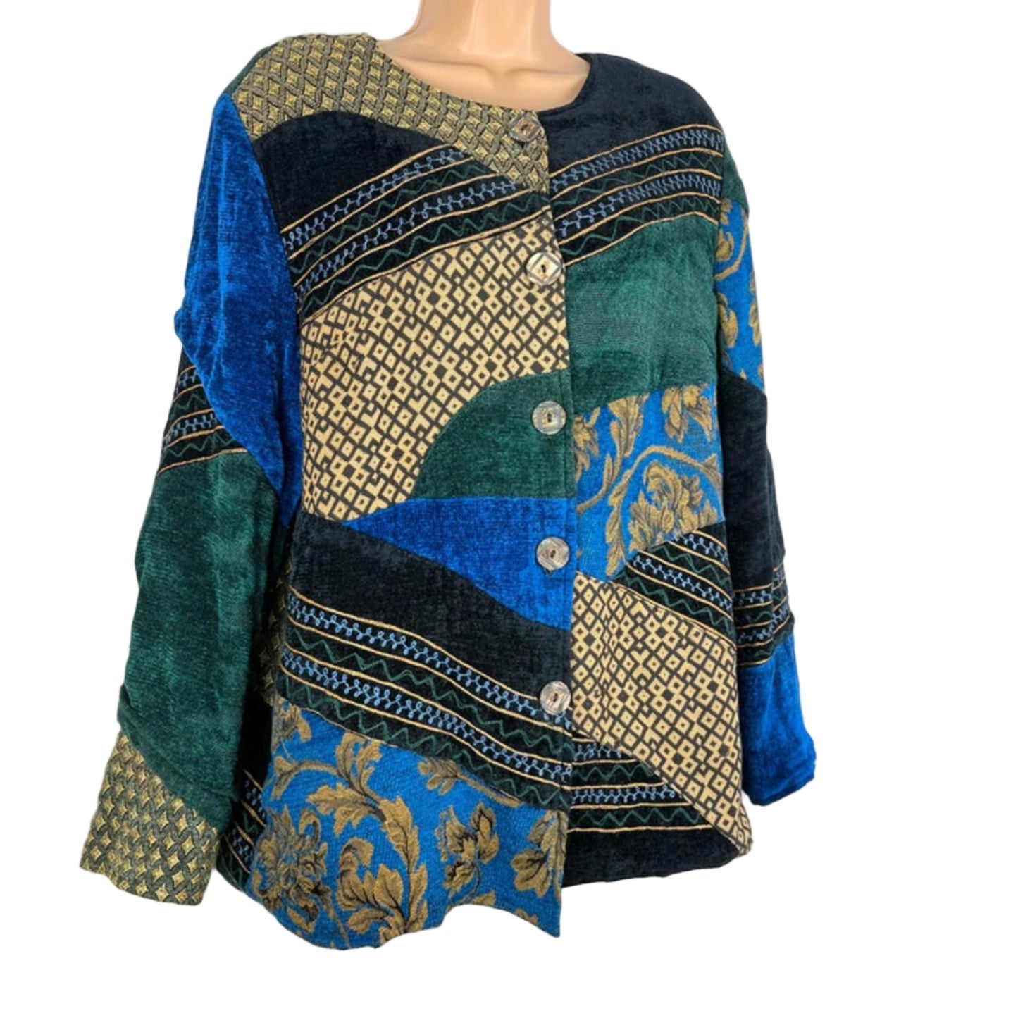 Mannequin wearing a colorful patterned garment with blue, green, and gold colors on a white background.