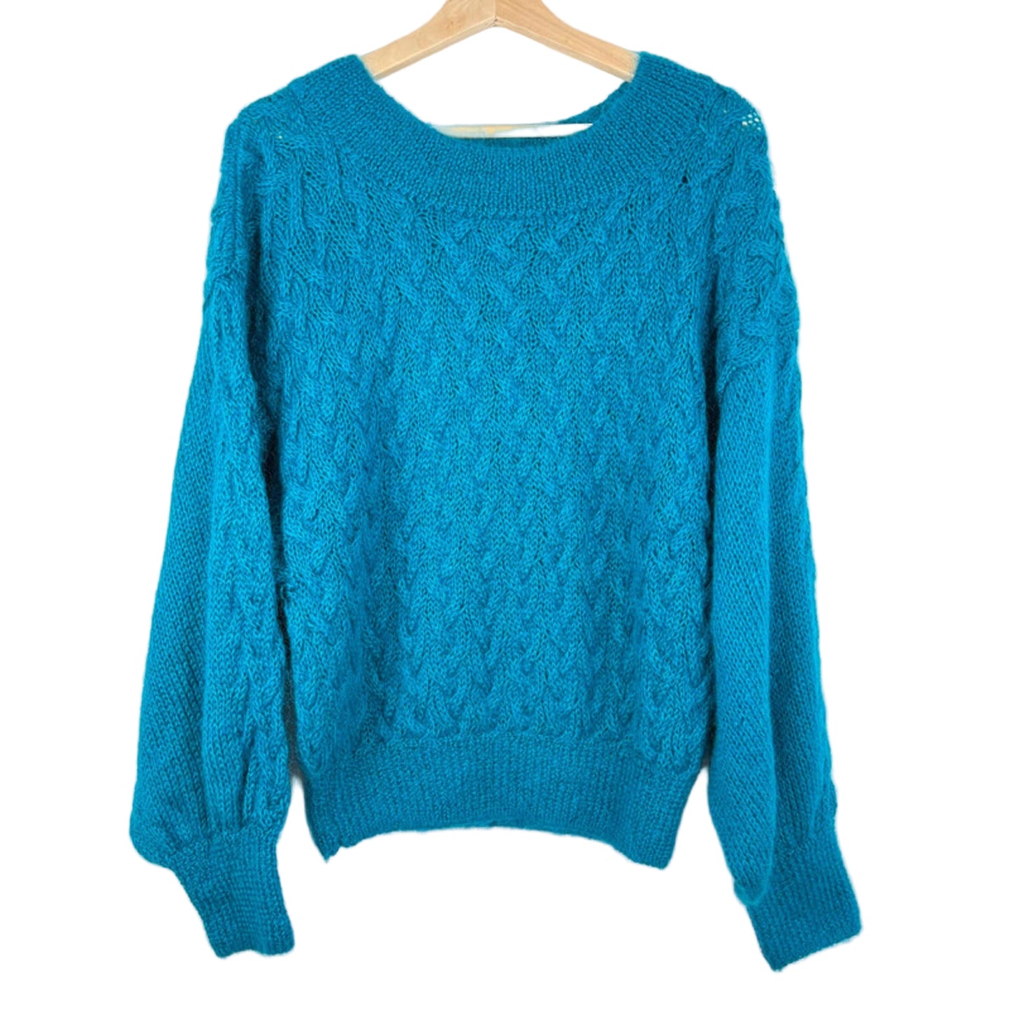 Blue sweater on a wooden hanger against a white background