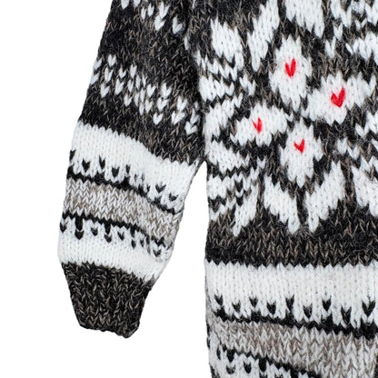 Knitted sweater with a pattern of hearts on a white background