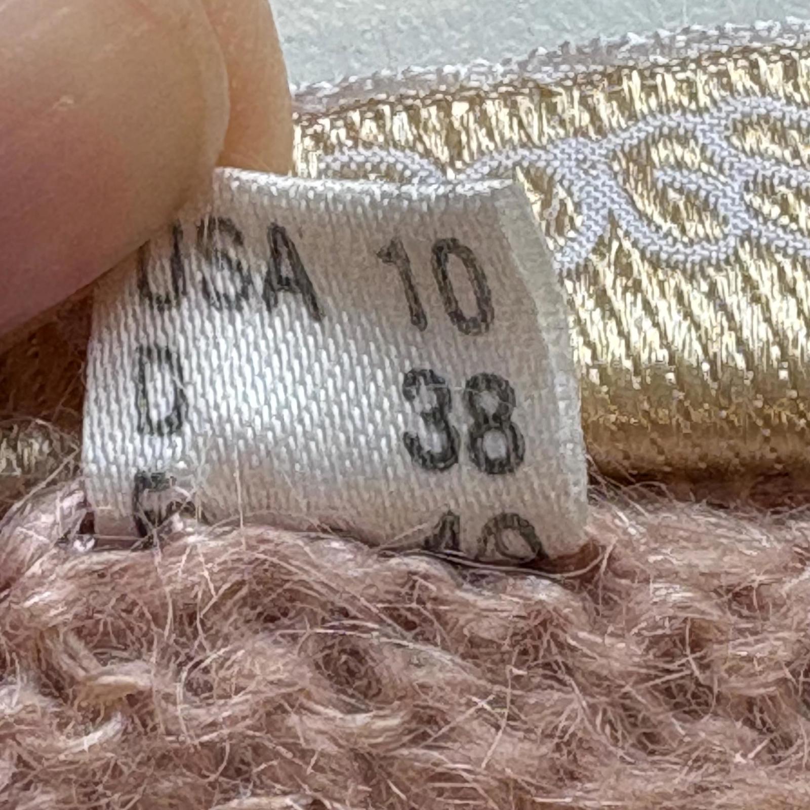 Close-up of a size label on a textured fabric background