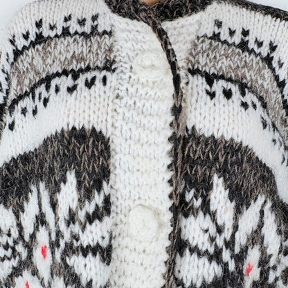 Close-up of a knitted garment with a patterned design.