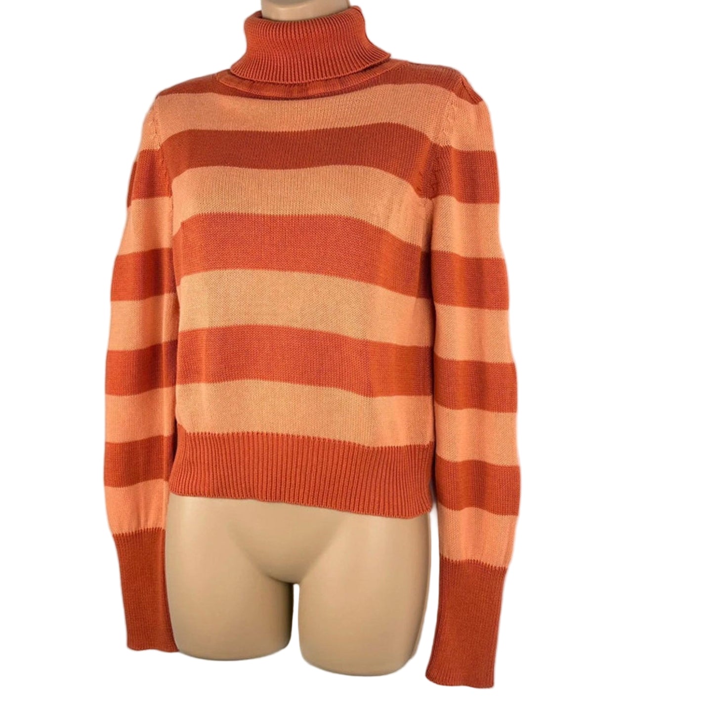 Orange and beige striped sweater on a mannequin against a white background