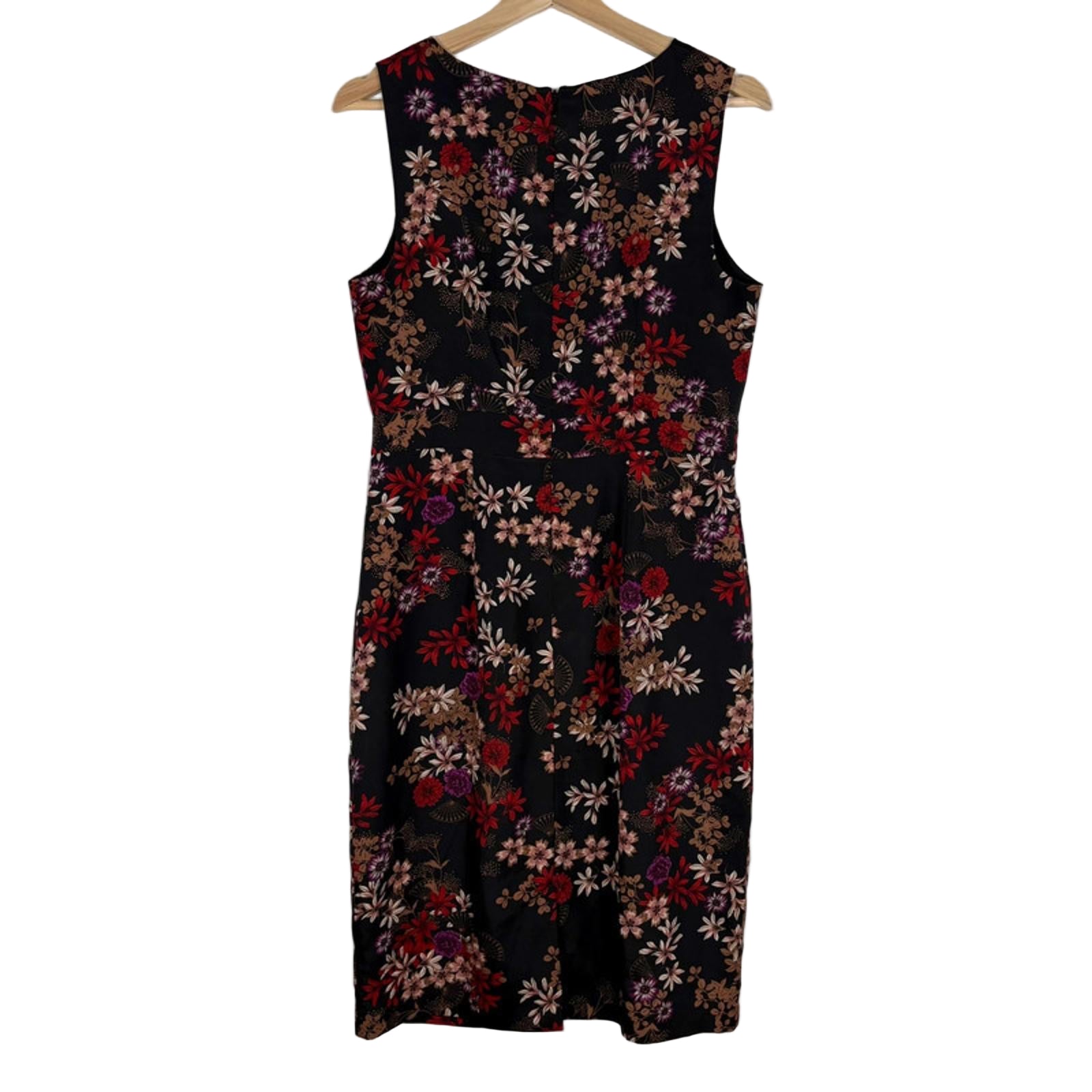 Back of Floral dress on a hanger against a white background