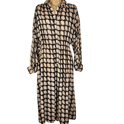 Patterned dress on a mannequin against a white background