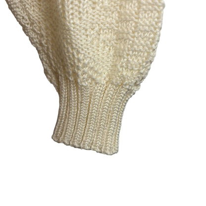 Close-up of a cream-colored sleeve on a white background
