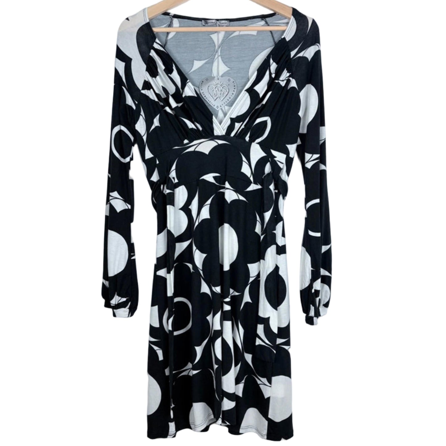 Black and white dress on a hanger on a white background