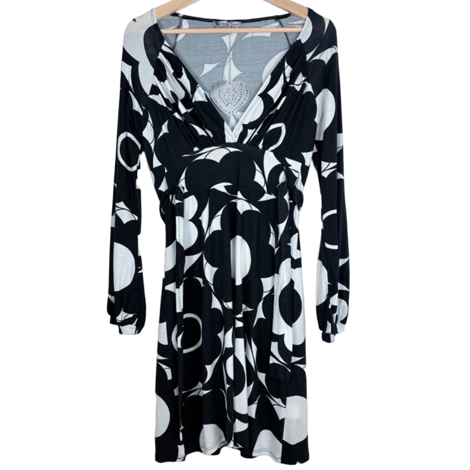 Black and white dress on a hanger on a white background