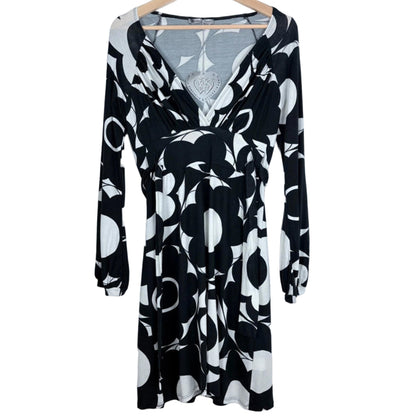 Black and white dress on a hanger on a white background