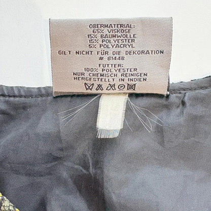 Fabric label with text on a gray fabric background