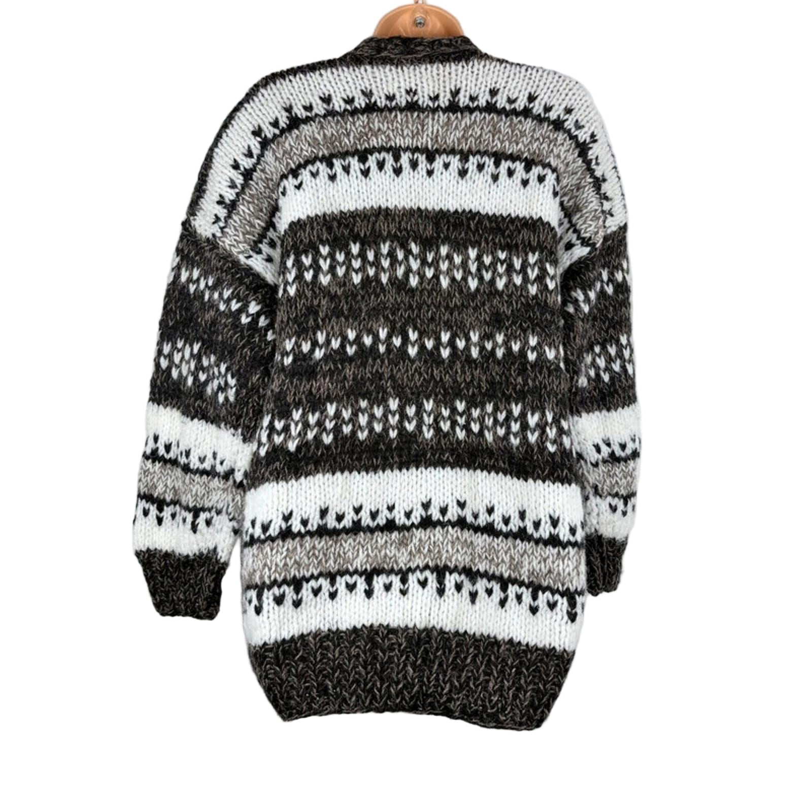Black and white striped sweater on a mannequin against a white background