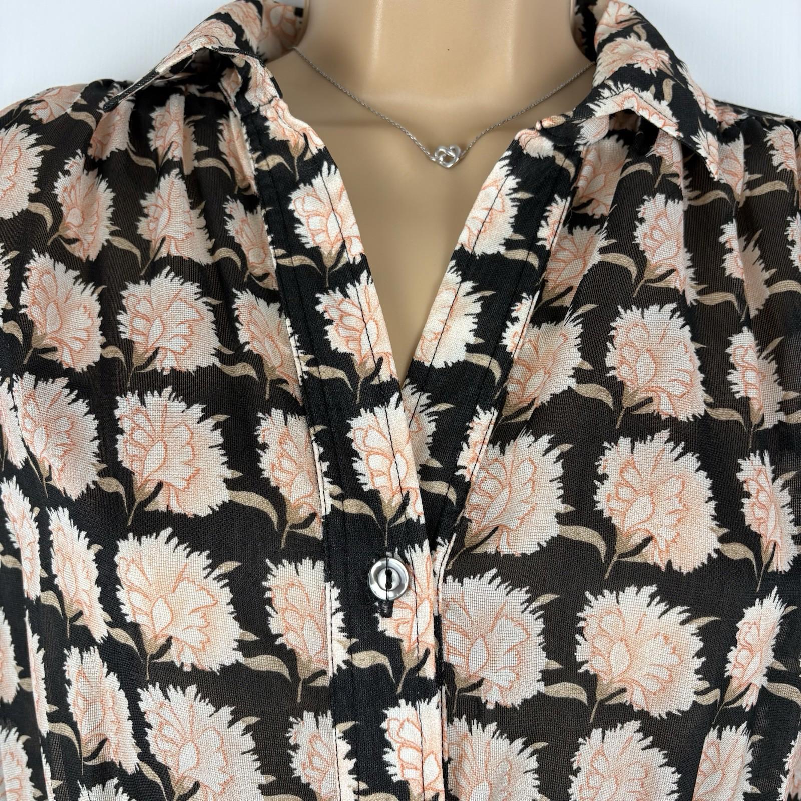 Floral patterned shirt on a mannequin with a neutral background