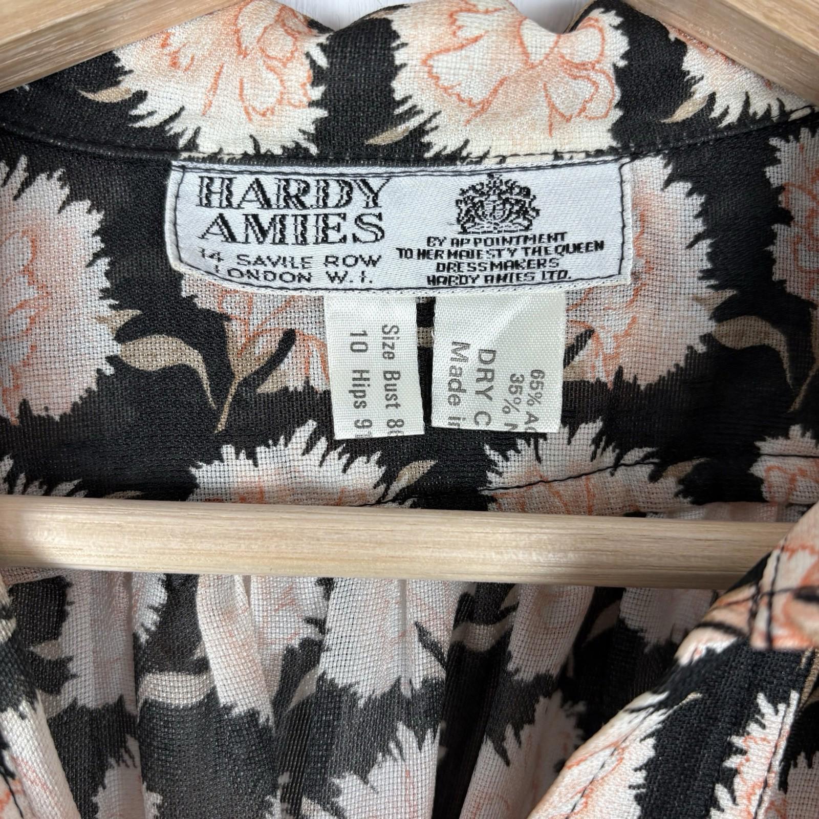 Hardy Amies label on a floral-patterned garment