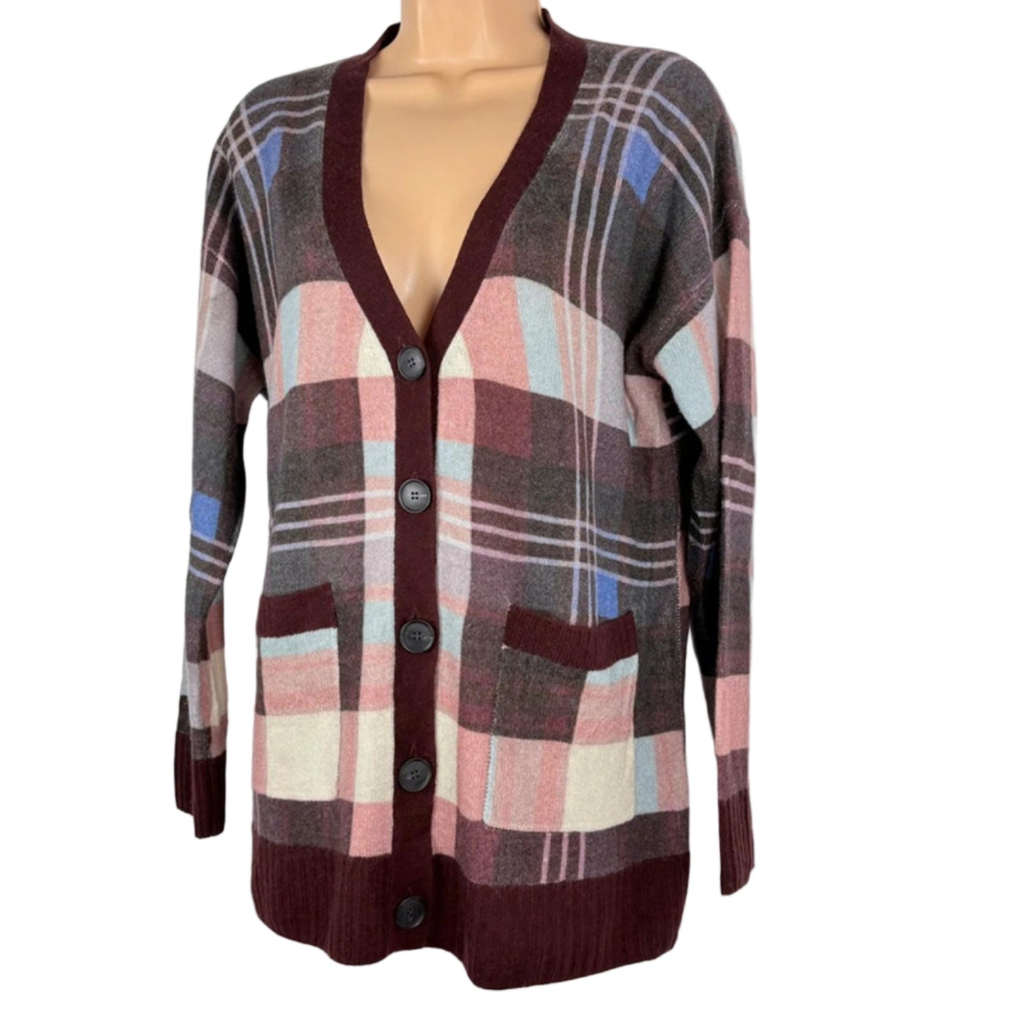 Plaid patterned cardigan on a mannequin against a white background