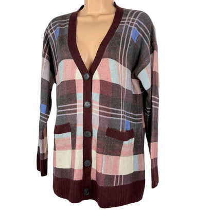 Plaid patterned cardigan on a mannequin against a white background