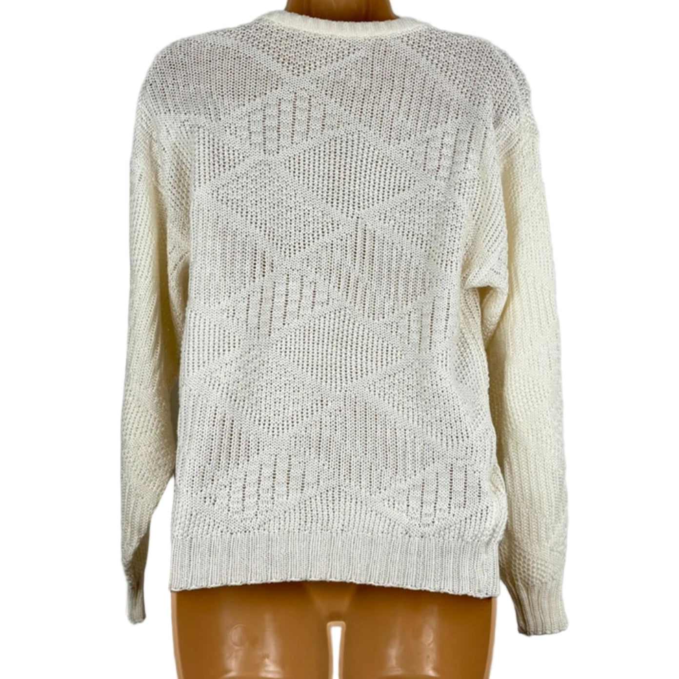 Beige knitted sweater on a mannequin against a plain background