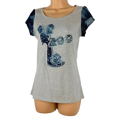 Gray t-shirt with blue graphic design on a mannequin against a white background
