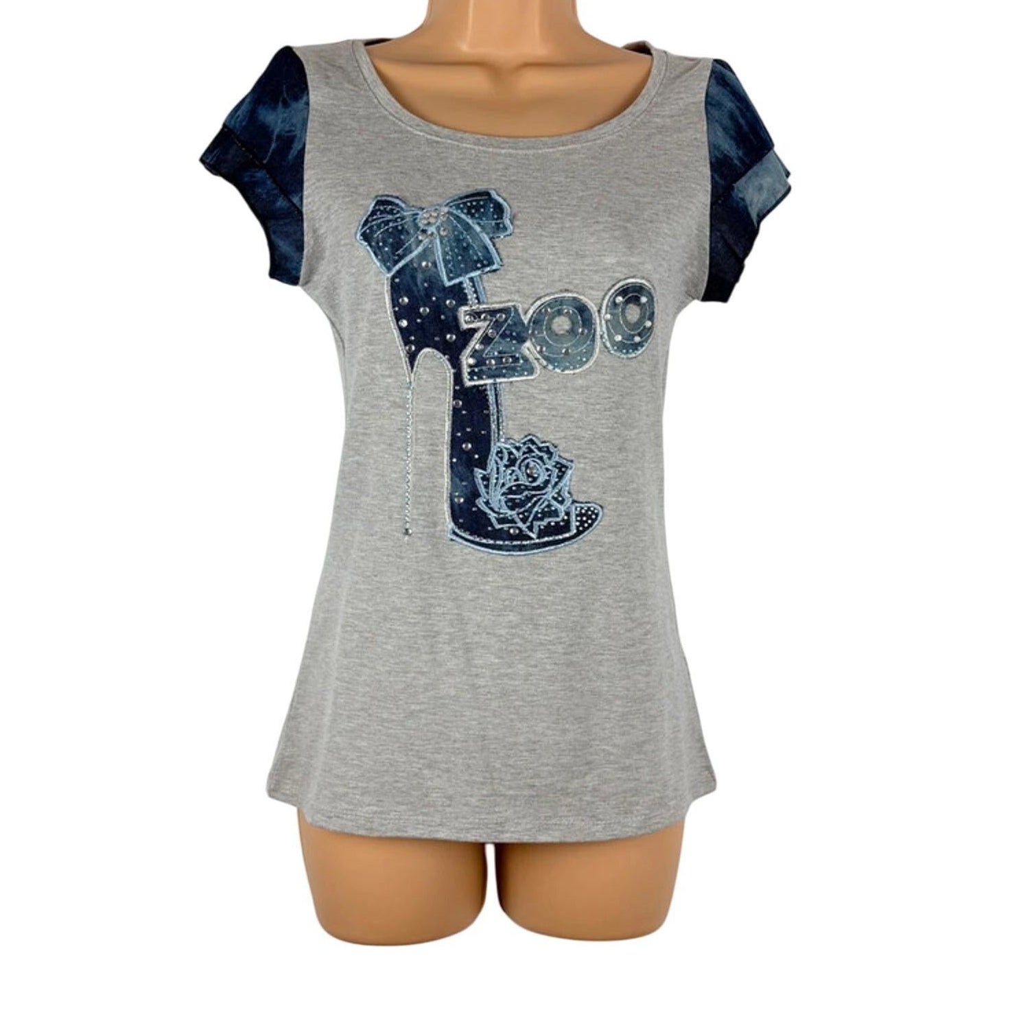 Gray t-shirt with blue graphic design on a mannequin against a white background
