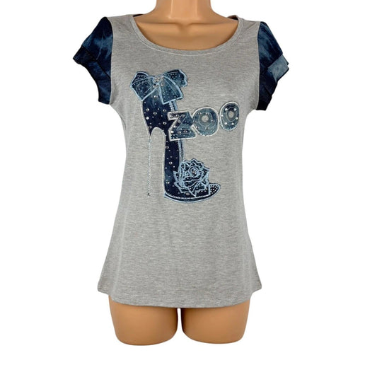 Gray t-shirt with blue graphic design on a mannequin against a white background