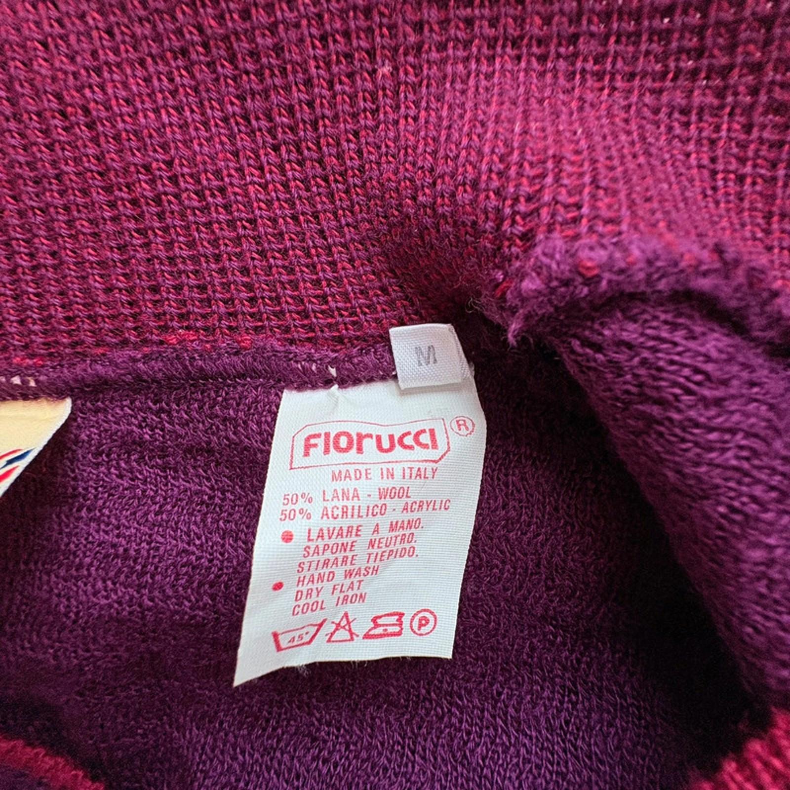 Close-up of a purple garment with a 'Florucci' label showing fabric composition and care instructions.