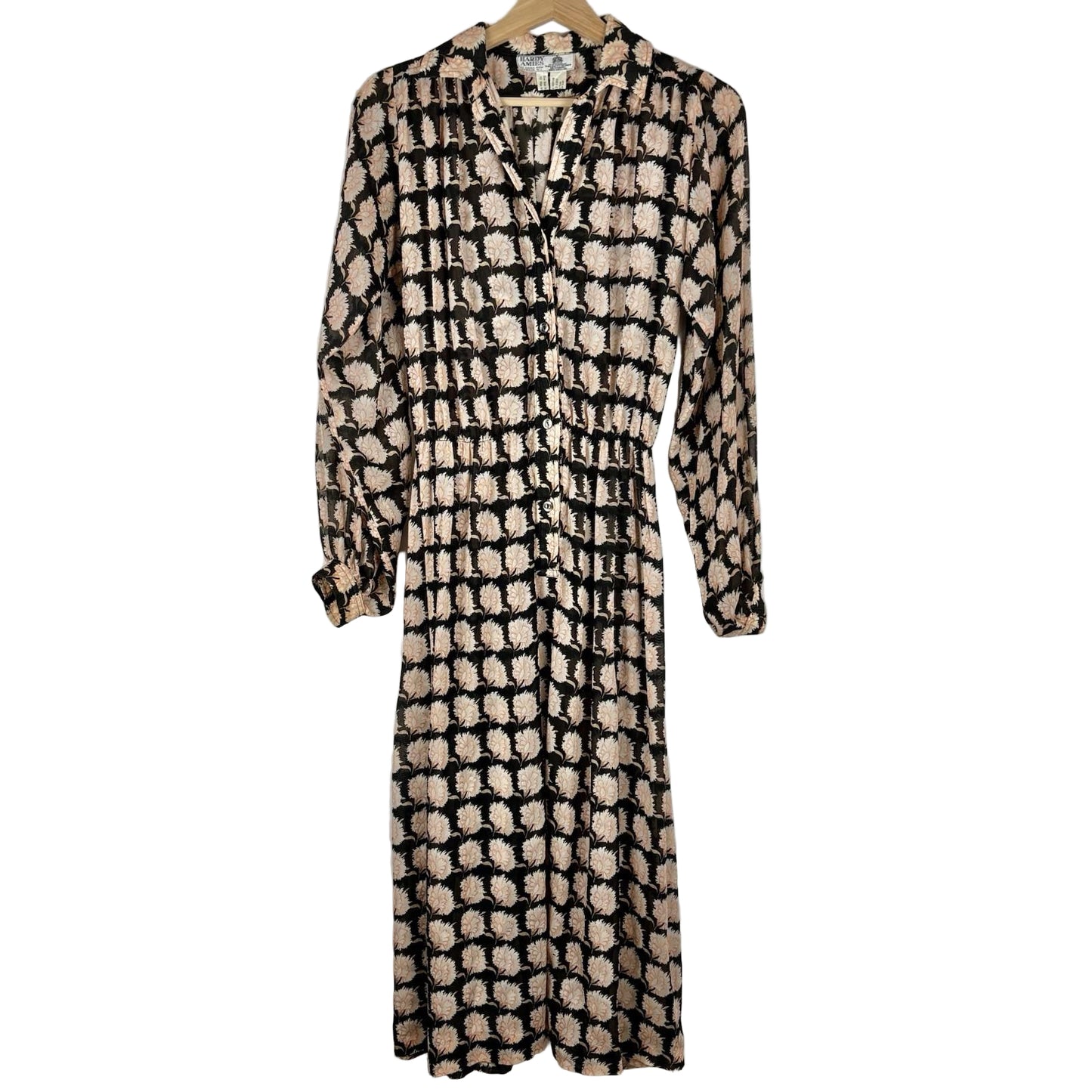 Patterned dress on a hanger against a white background