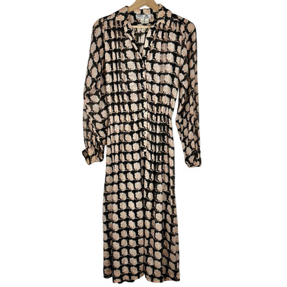 Patterned dress on a hanger against a white background