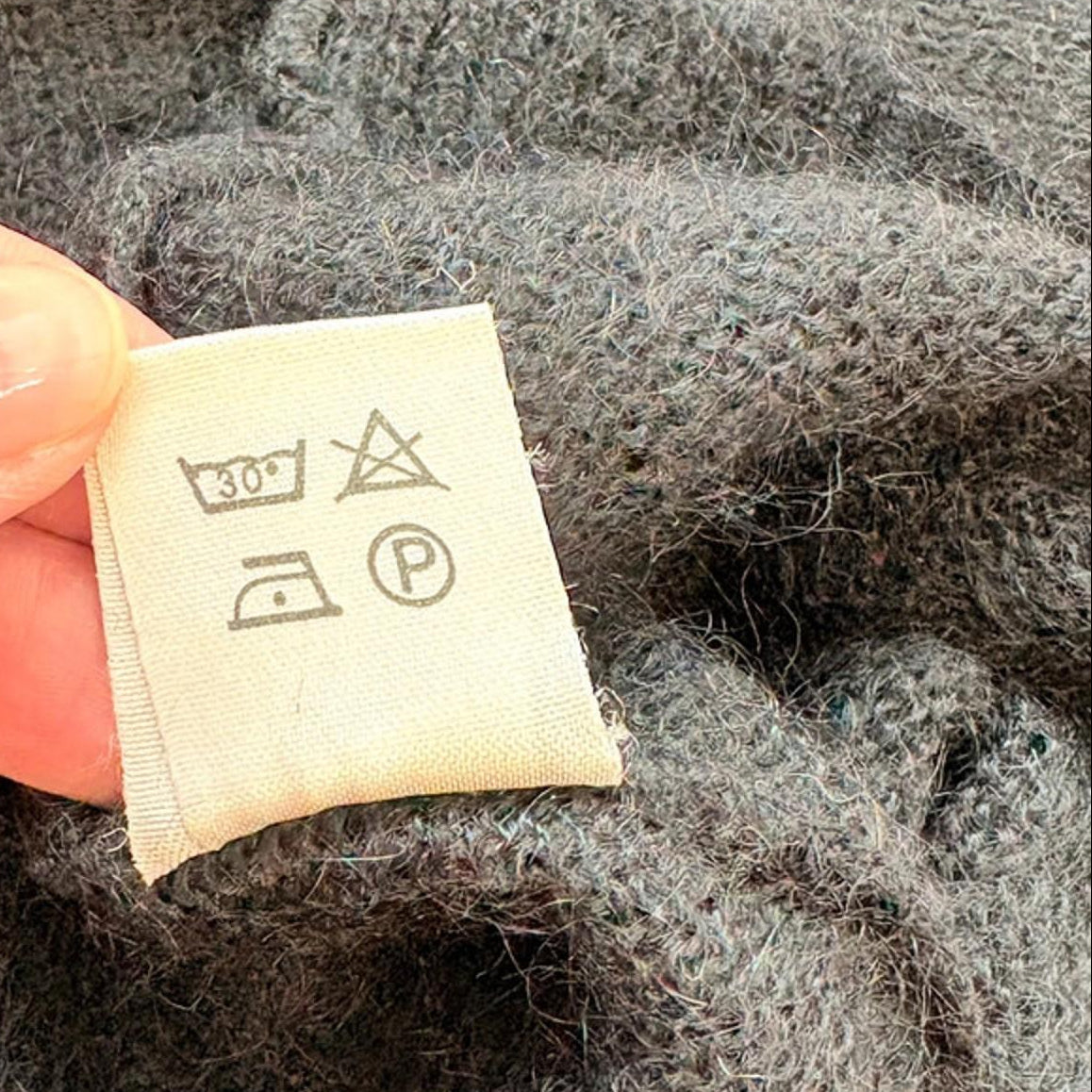 Clothing label on a textured fabric background