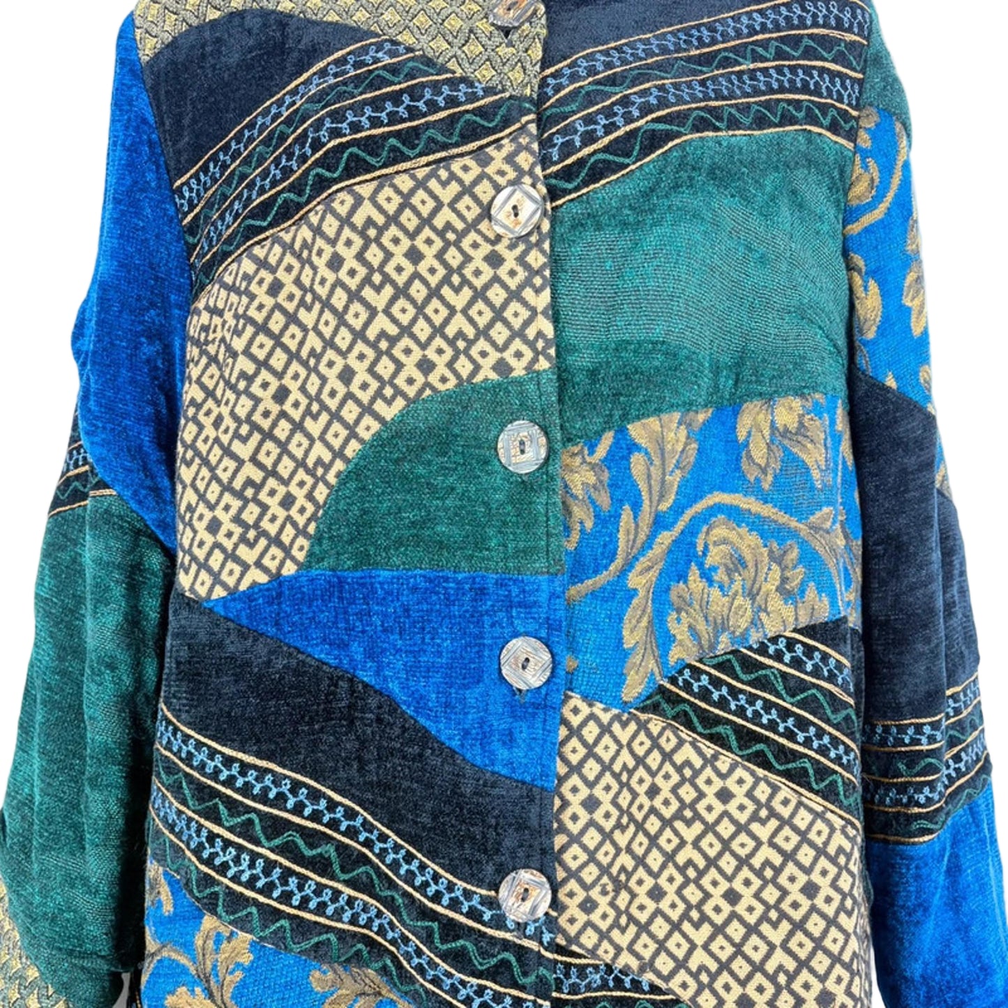 Patchwork jacket with blue, green, and gold patterns on a light blue background