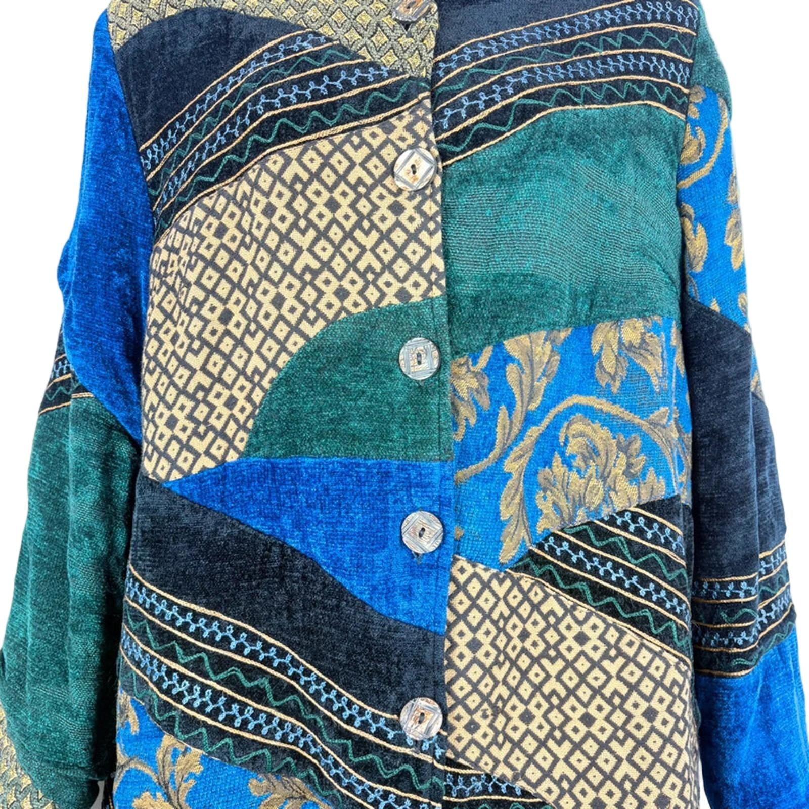 Patchwork jacket with blue, green, and gold patterns on a light blue background