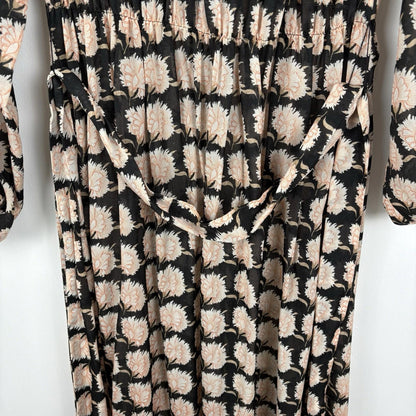 Floral patterned fabric with black, beige, and white colors on a white background