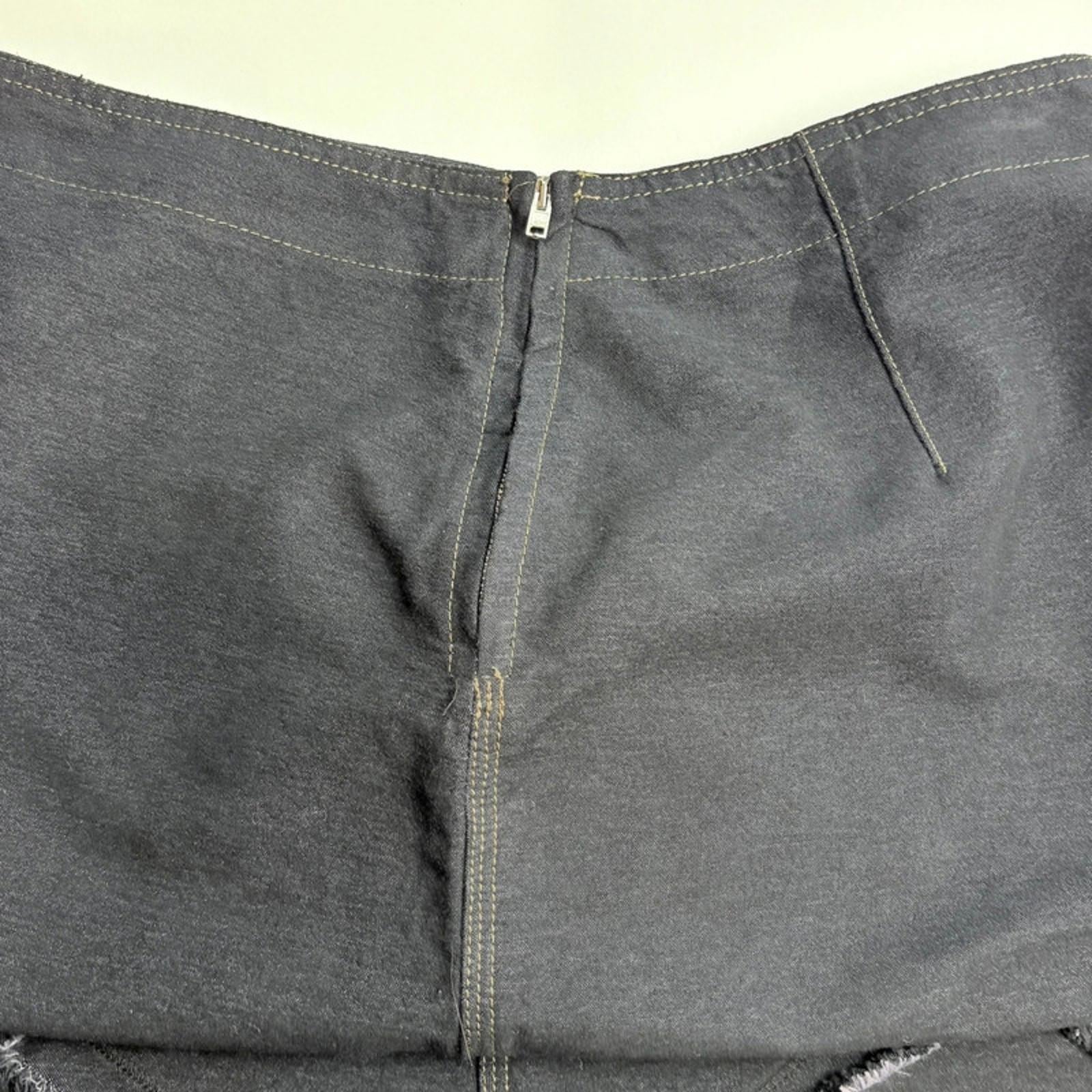 Close-up of gray pants with a zipper on a white background