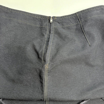 Close-up of gray pants with a zipper on a white background