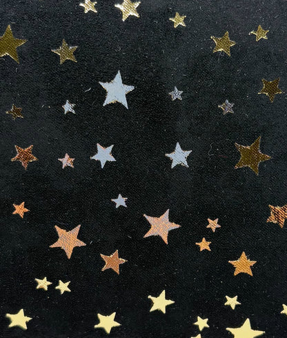 Black fabric with gold star patterns