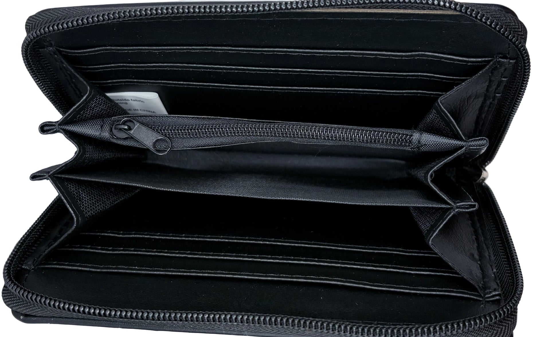 Black zippered pouch with multiple compartments on a black background