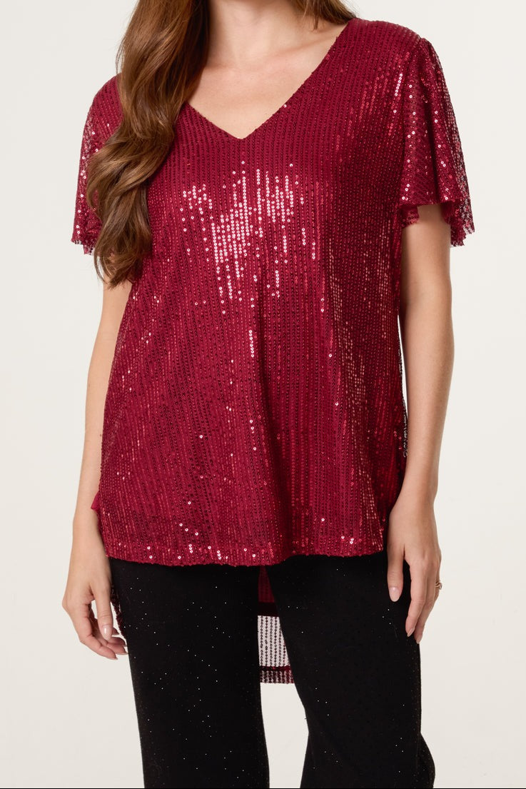 Red sequin top on a model 