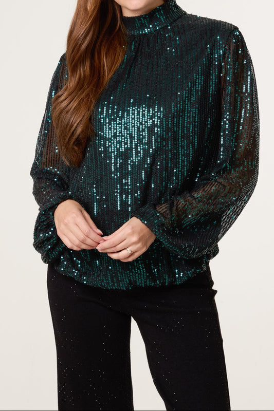 Green sequin top on a model 